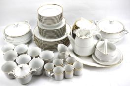 A BHS white and gold eight setting dinner service.