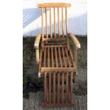 A contemporary wooden slatted garden sun chair.
