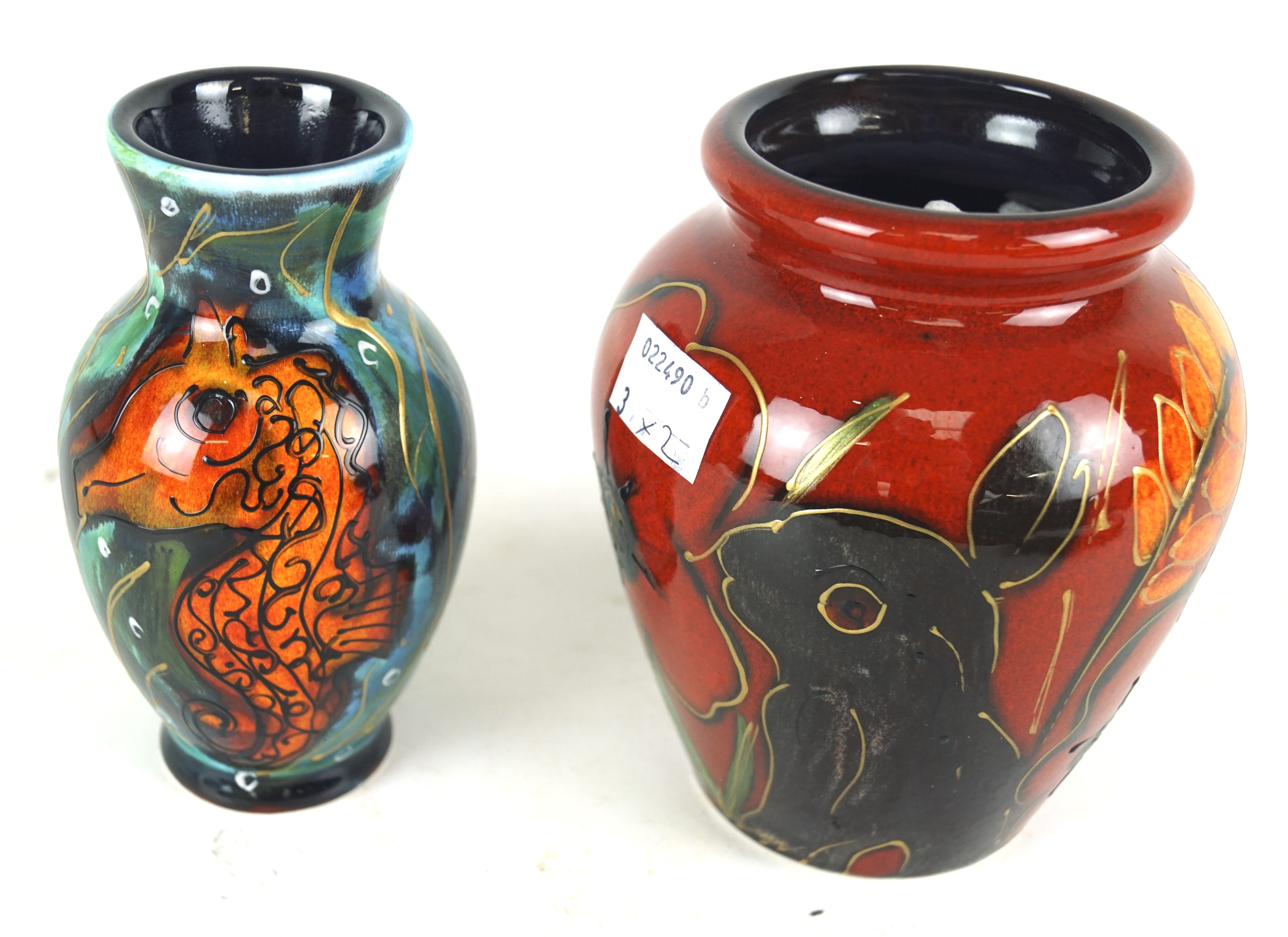 An Anita Harris seahorse vase and a rabbit vase.