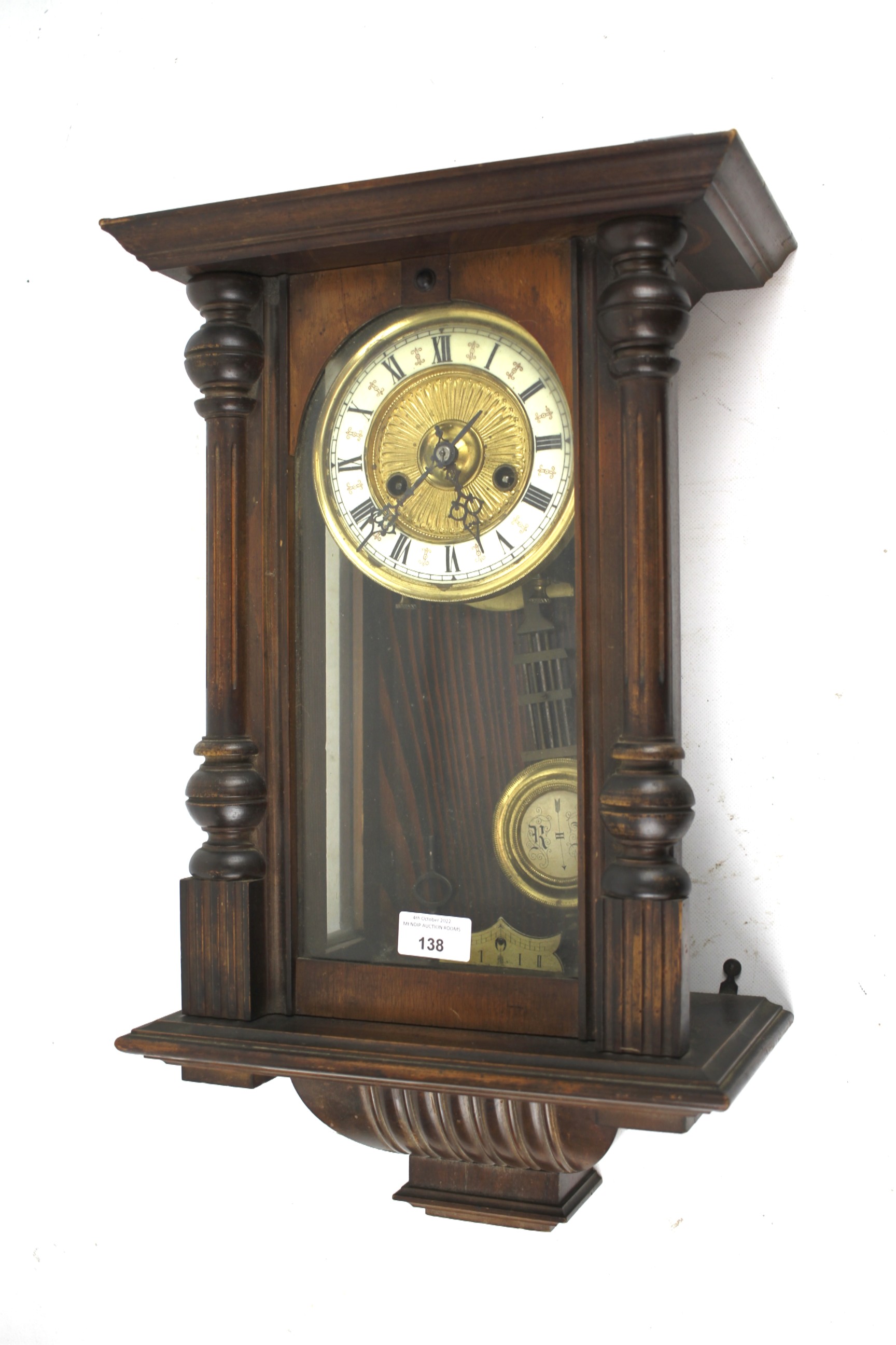 A mahogany cased Austrian style wall clock.