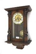 A mahogany cased Austrian style wall clock.