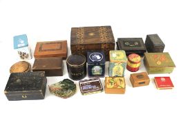 An assortment vintage wooden boxes and collectors tins.
