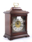 A 20th century stained wooden cased mantel clock by Eccles of Liverpool.