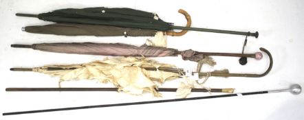 An assortment of five Edwardian and later parasols. In need of restoration.