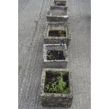 Five stone composite garden pots. Five of splayed square form, all with brickwork pattern.