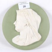 A 19th century ceramic plaque depicting Queen Victoria. Of circular form, measuring 16.