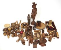 A large assortment of treen. Including fruits, bowls, candlestick, large figure, etc.
