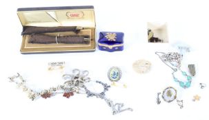 Ad assortment of costume jewellery. Including two gilt cross pen and pencil set in original box.