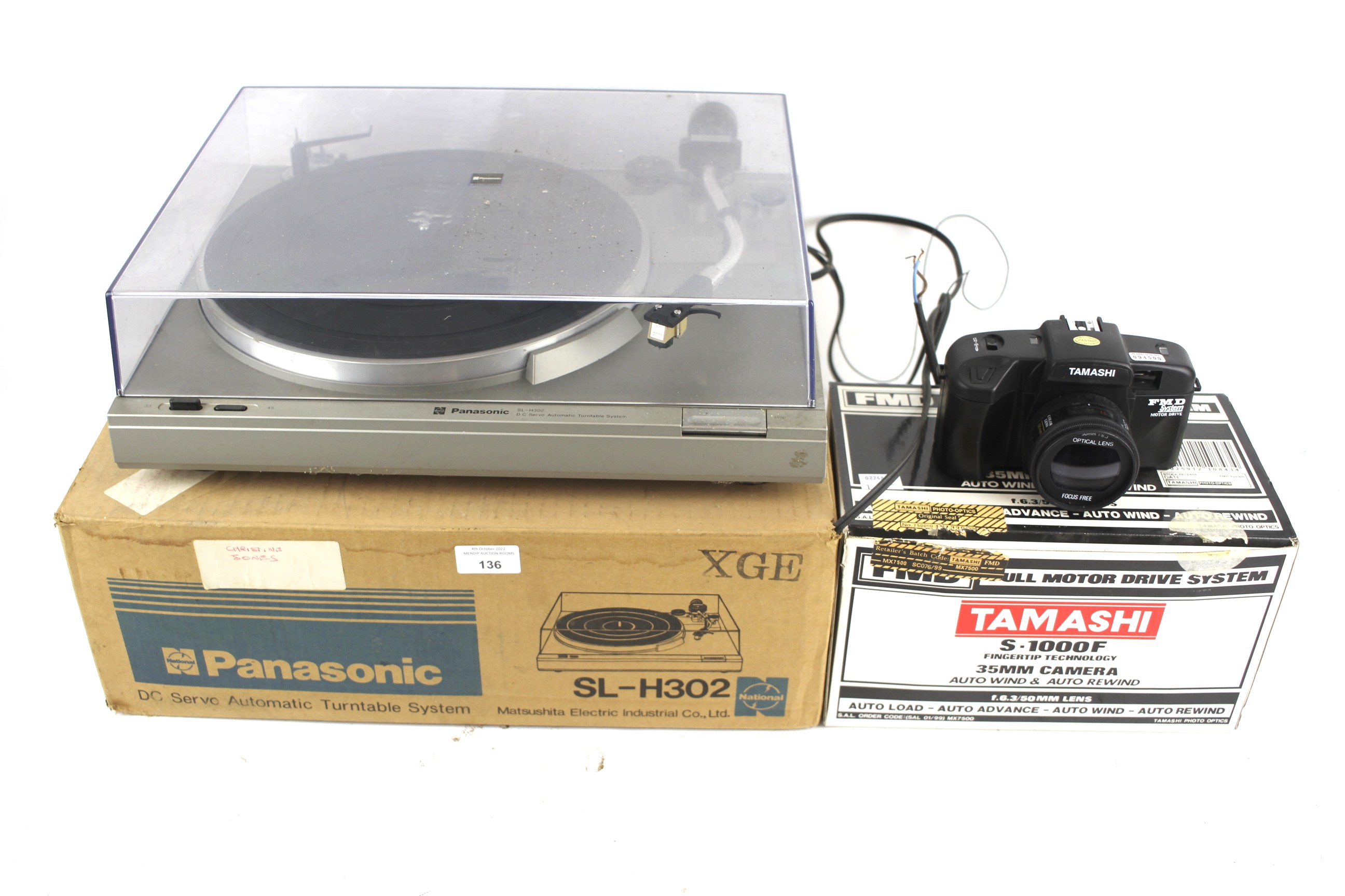 A Panasonic Sl-H302 record player and a Tamashi 35mm camera. Both boxed.