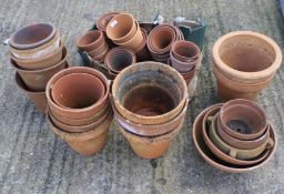 An assortment of terracotta plant pots.