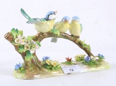 A Crown Staffordshire bone china model of birds by JT Jones.