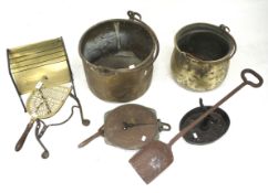 An assortment of metalware including pans, boot scraper, trivet,