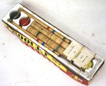 A mid-20th century boxed complete four person croquet set.