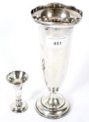 A large silver posy vase and a smaller vase.