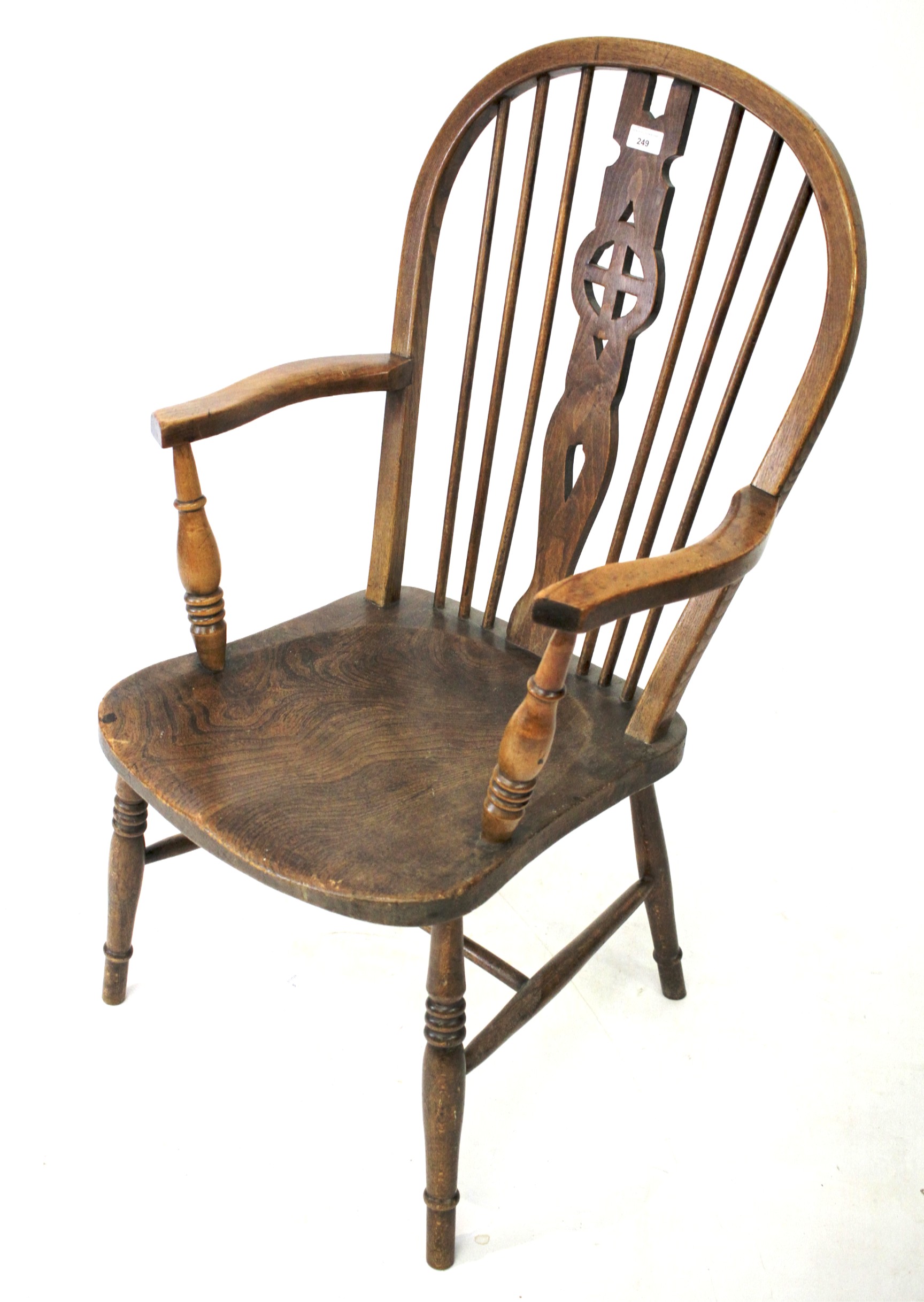 An elm seated hooped back elbow chair, H100cm.