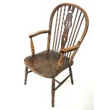 An elm seated hooped back elbow chair, H100cm.