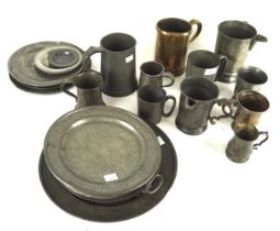 A large assortment of pewter mugs, plates, warming dishes, etc.