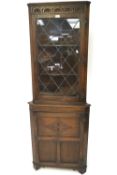 A 20th century mahogany carved display cabinet.