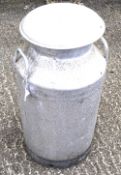 A milk churn with lid and two side handles. Lid marked 'PULLIN BROS CHEWTON MENDIP'.