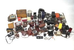 Large collection of vintage cameras and photographic items.