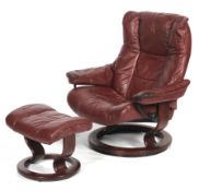 A Stressless-style armchair and footstool.