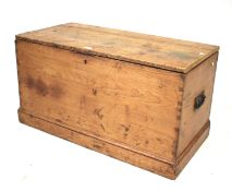 A 19th century twin handled pine trunk with plinth base. L89cm x D34.5cm x H47.5cm.