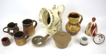 An assortment of mixed studio ceramics including mugs, jugs salts, etc.