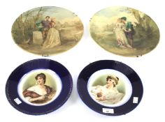 A pair of painted glass chargers and two French porcelain portrait plates.