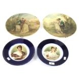 A pair of painted glass chargers and two French porcelain portrait plates.