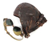 WW2 Fighter pilot's leather helmet and goggles. The goggles with green lenses.