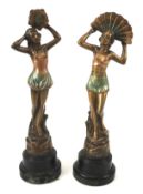 A pair of bronzed Art Deco figures of ladies.