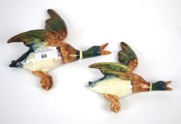 A pair of Beswick pottery ducks in sizes. Printed and impressed marks, shape 596-3 & 4, 17.