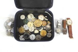 A collection of vintage wristwatches and parts.