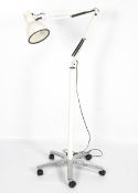A contemporary Anglepoise 82EL white trolley floor lamp. Raised upon five supports on castors.
