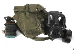 Two 20th century gas masks. One full face marked 1968 LBR Co, in original satchel bag.