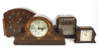 Four assorted, wooden cased mantel clocks.