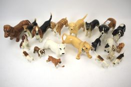 A collection of Beswick pottery models of dogs and others similar.
