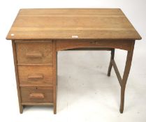 An Arts and Crafts single pedestal desk.