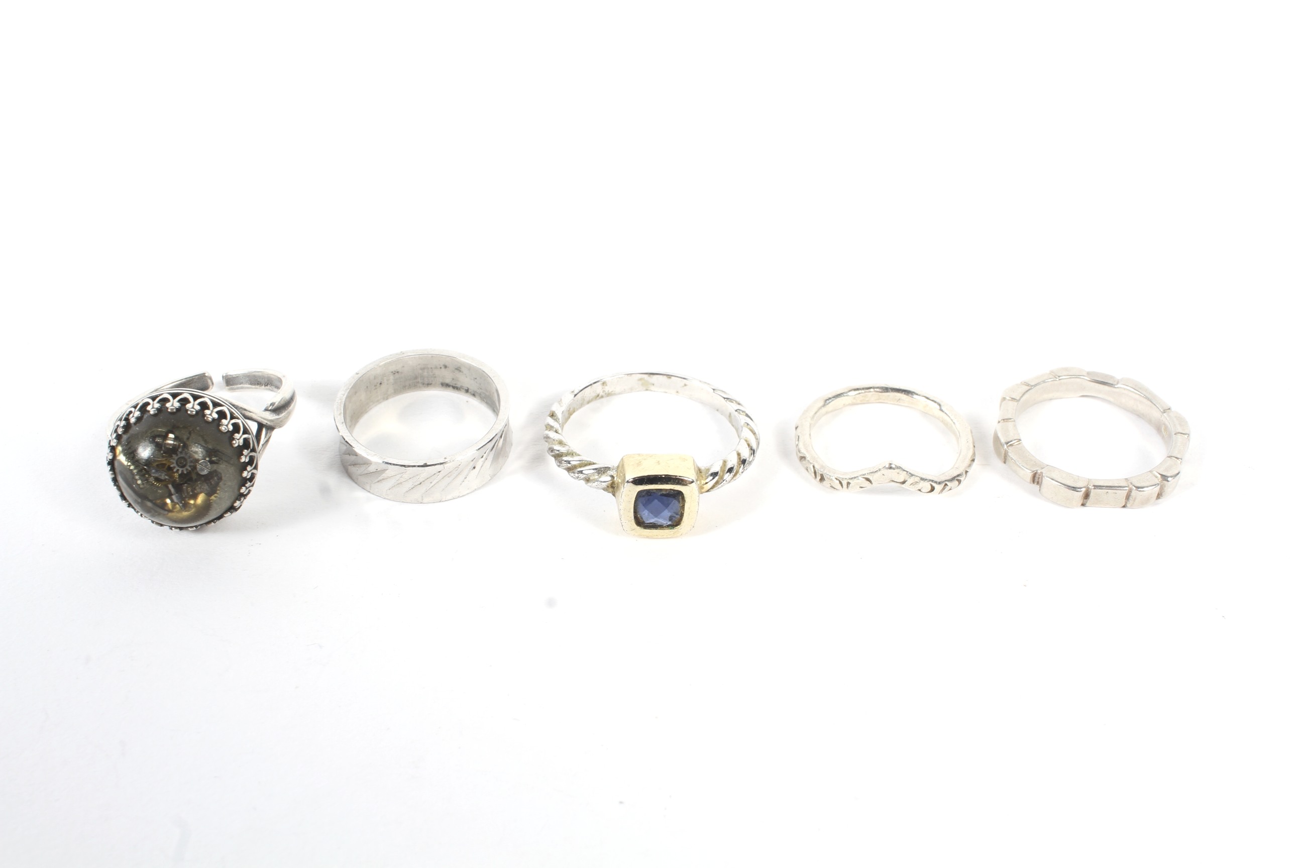 A collection of five vintage ladies white metal rings.