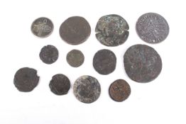 Twelve Roman coins, two being copies.
