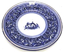 A 19th century pottery blue and white circular dish.