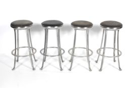 Four vintage chrome bar stools.