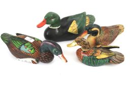 Four 20th century painted wooden ducks.