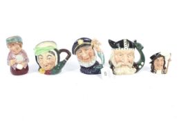 Five Royal Doulton miniature character jugs. Including Madam Crystal, Old Salt, Viking, Athos.