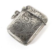 A small silver Vesta case engraved with leaves.