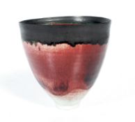 A red glazed studio porcelain vase.