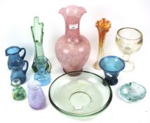 A group of transparent coloured glass vessels.