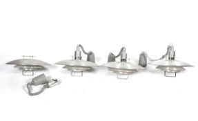 Four contemporary Danish style aluminium and powder coated adjustable light pendants.