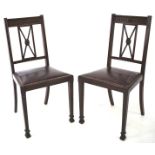 Two mahogany dining chairs.