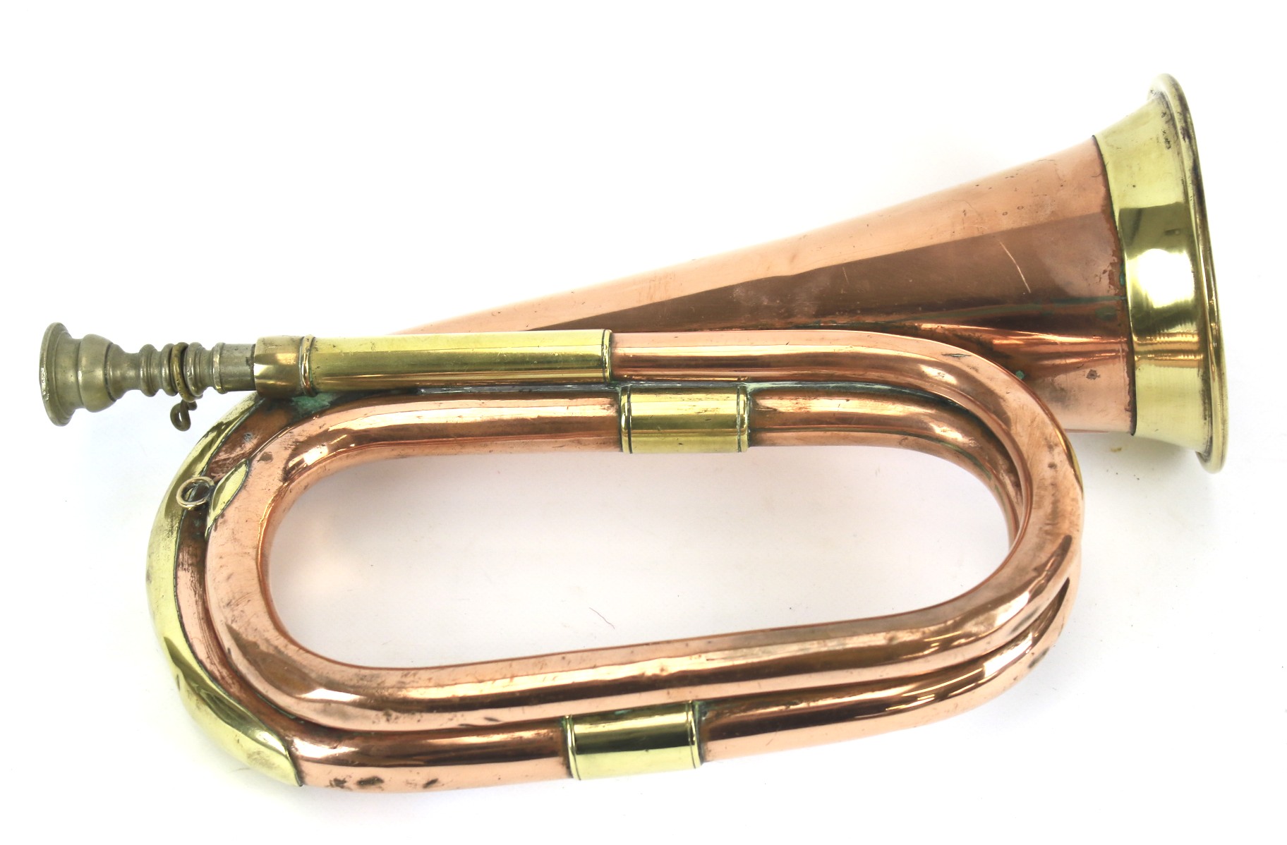 A vintage brass and copper bugle.